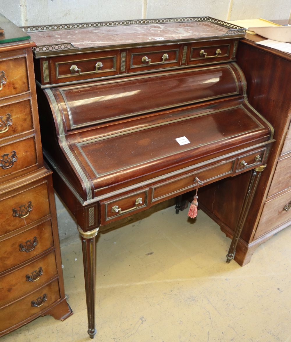 A mid 19th century French ormolu mounted mahogany cylinder front bureau, with marble top, W.80cm